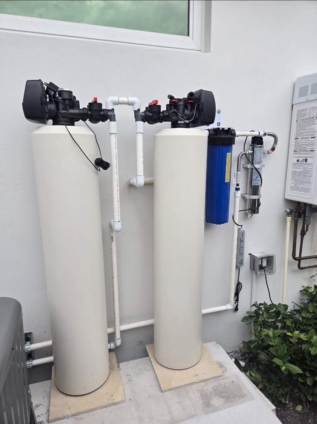 Dual-tank whole-house carbon filtration and water softener system with Big Blue filter and UV chamber